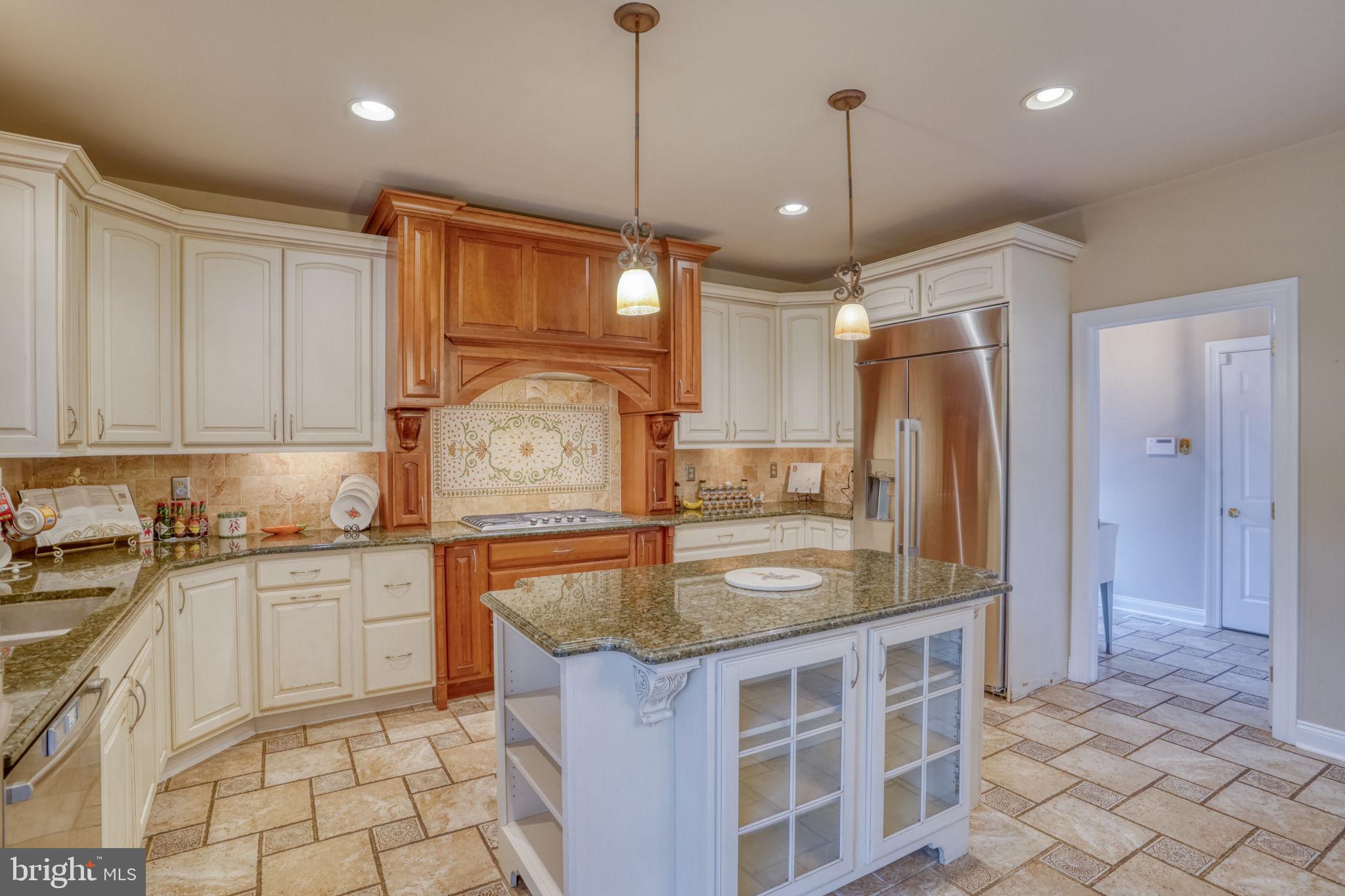 357 Willits Way Garnet Valley, PA 19060 - Photo 25 of 63 a kitchen with granite countertop a sink a counter top space appliances and cabinets