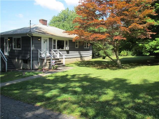 48 Whisconier Road Brookfield, CT 06804 - Photo 1 of 1 a front view of a house with garden and patio