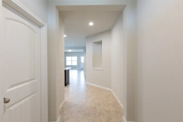 a view of hallway with wooden floor