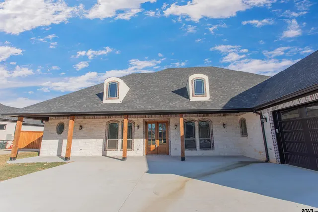 a front view of a house with a garage