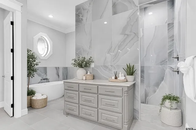 a bathroom with a potted plant and a sink