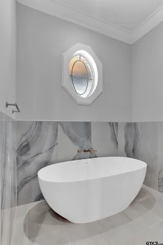a white bath tub sitting in a bathroom