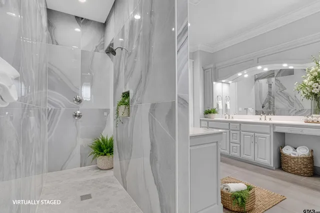 a spacious bathroom with a granite countertop sink a toilet and shower