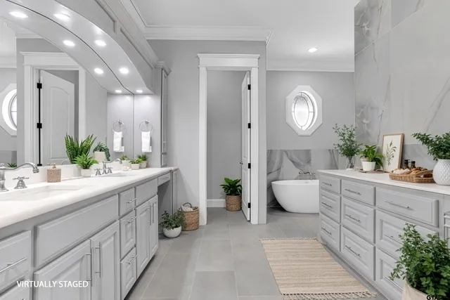 a spacious bathroom with a double vanity sink and a mirror