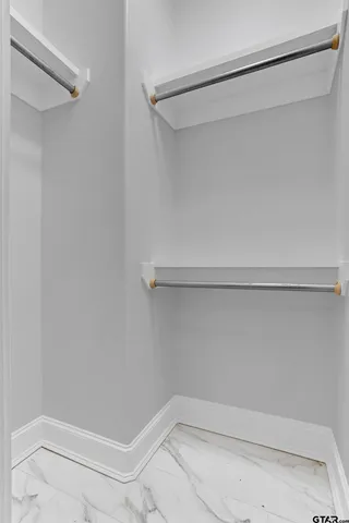 a view of an empty walk in closet