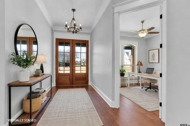 a view of a livingroom with furniture window and wooden floor