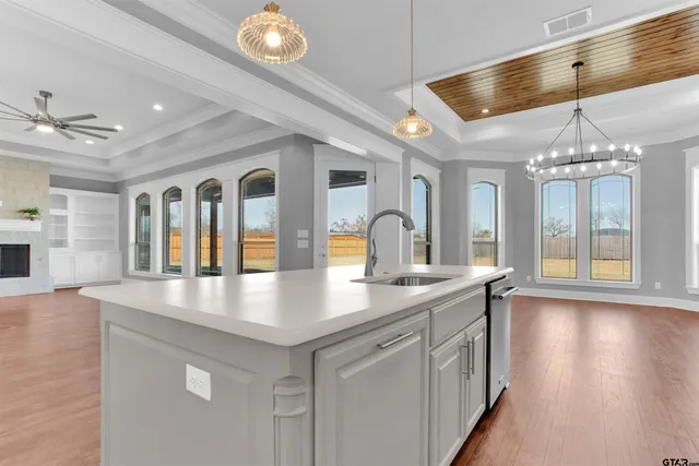 a view of a living room and chandelier