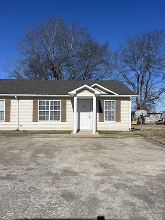 front view of a house with a garden