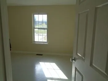 a view of an empty room and window
