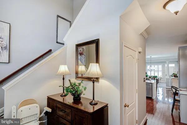 a living room with furniture and a mirror