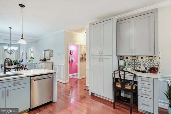 a kitchen with a sink and cabinets