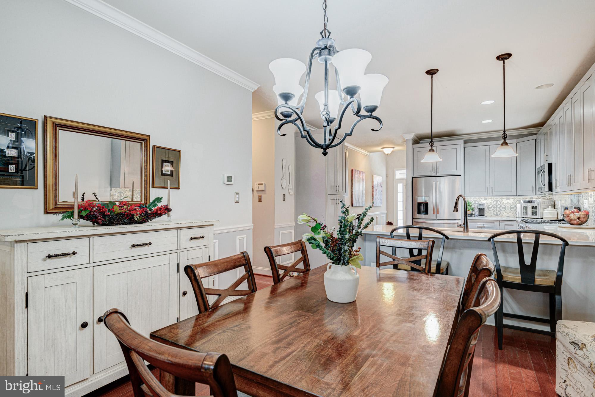 103 Candor Lane Dover, DE 19901 - Photo 15 of 38 a view of a dining room with furniture and wooden floor