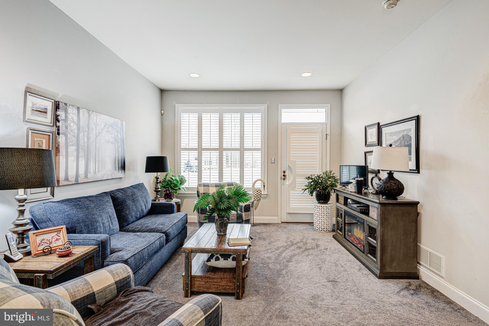 103 Candor Lane Dover, DE 19901 - Photo 16 of 38 a living room with furniture and a flat screen tv