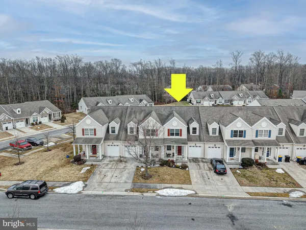 a view of multiple houses with a yard
