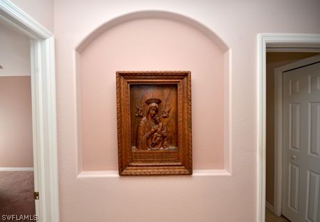28 Michigan Road Lehigh Acres, FL 33936 - Photo 12 of 20 a view of a hallway with wooden floor