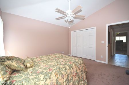 28 Michigan Road Lehigh Acres, FL 33936 - Photo 13 of 20 a view of a bedroom with a bed and closet