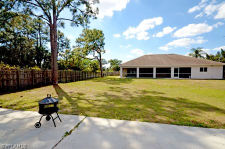28 Michigan Road Lehigh Acres, FL 33936 - Photo 15 of 20 a view of a swimming pool with a patio