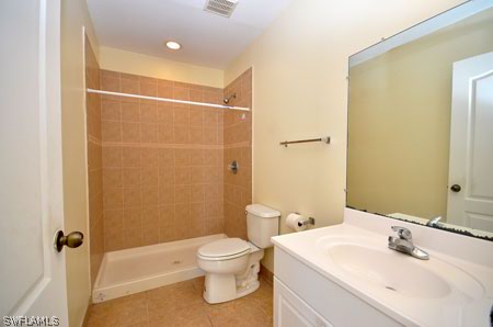 28 Michigan Road Lehigh Acres, FL 33936 - Photo 18 of 20 a bathroom with a sink a toilet and shower