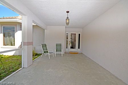 28 Michigan Road Lehigh Acres, FL 33936 - Photo 2 of 20 a view of empty room with front door