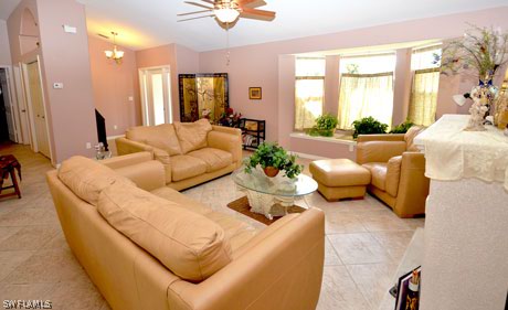 28 Michigan Road Lehigh Acres, FL 33936 - Photo 4 of 20 a living room with furniture and a large window