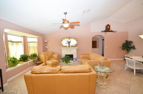 28 Michigan Road Lehigh Acres, FL 33936 - Photo 5 of 20 a living room with furniture and a large window