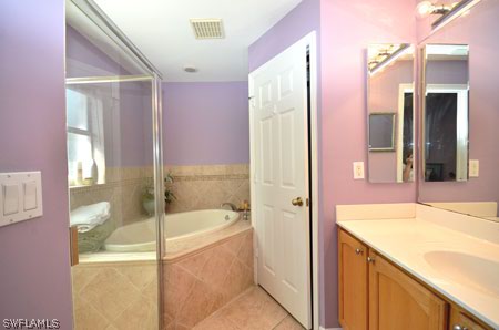 28 Michigan Road Lehigh Acres, FL 33936 - Photo 10 of 20 a bathroom with a bathtub and a sink
