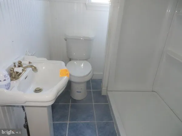 a bathroom with a sink and toilet