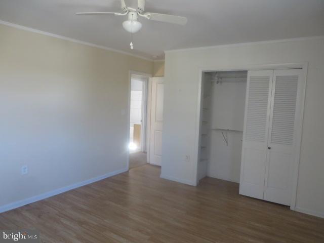 3604 Newportville Road Bristol, PA 19007 - Photo 9 of 13 an empty room with wooden floor and windows