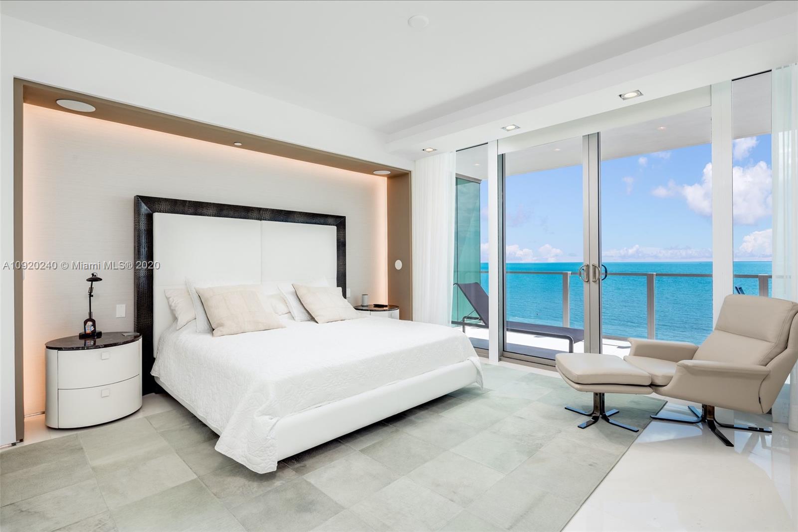 360 Ocean Drive, Unit 804S Key Biscayne, FL 33149 - Photo 12 of 49 a bedroom with a bed and large window
