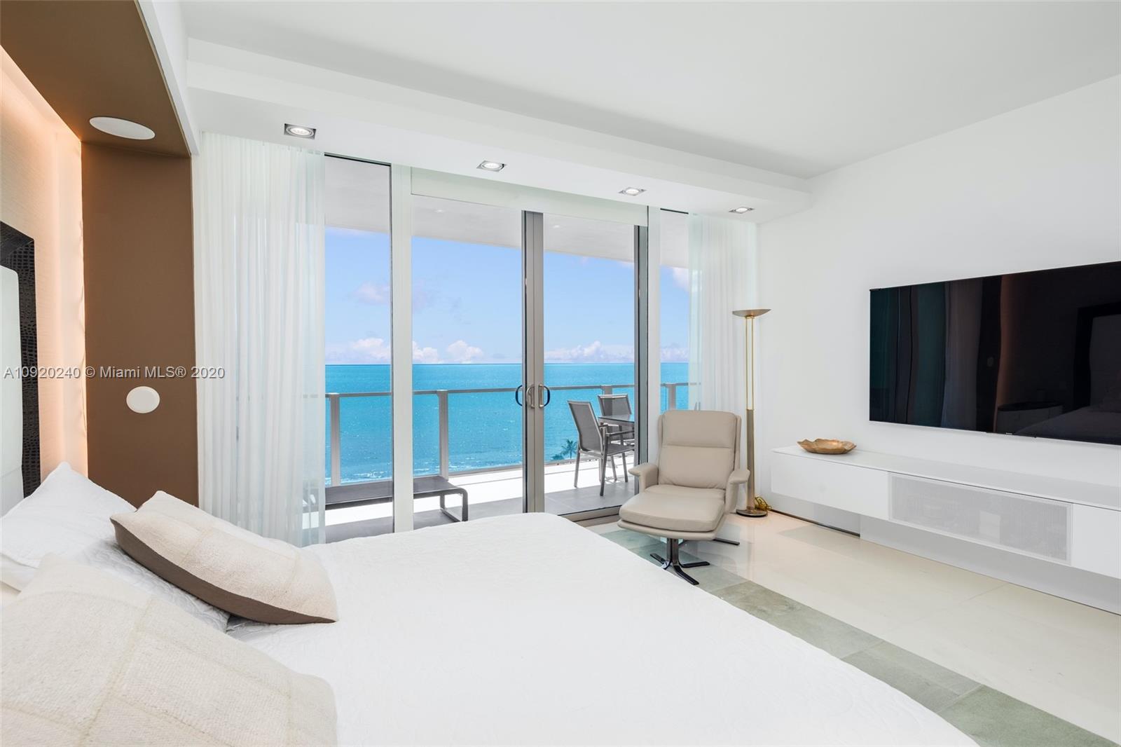 360 Ocean Drive, Unit 804S Key Biscayne, FL 33149 - Photo 13 of 49 a bedroom with a bed and large window