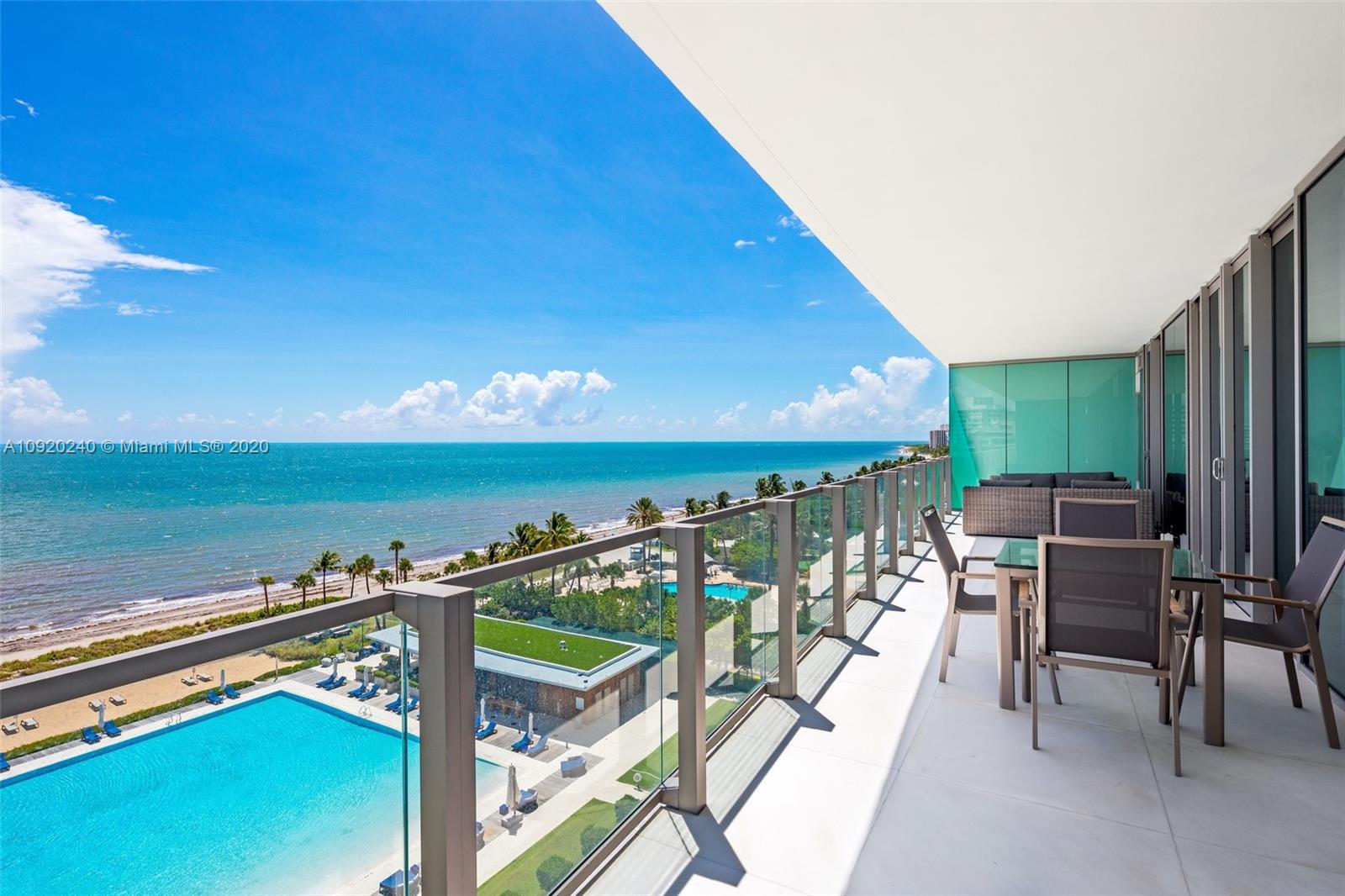 360 Ocean Drive, Unit 804S Key Biscayne, FL 33149 - Photo 25 of 49 a view of a chairs and table in patio