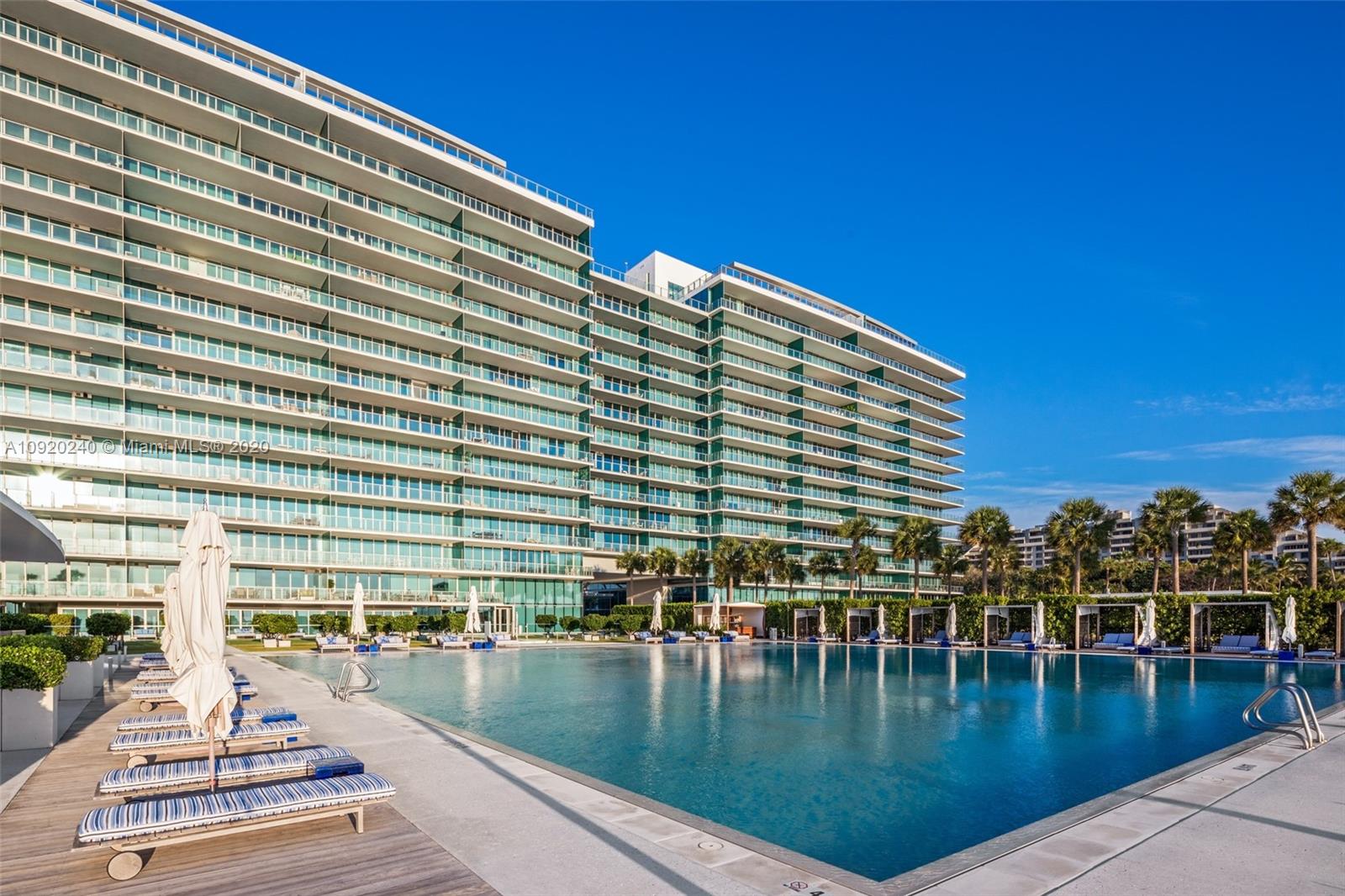 360 Ocean Drive, Unit 804S Key Biscayne, FL 33149 - Photo 29 of 49 a view of a swimming pool with outdoor seating