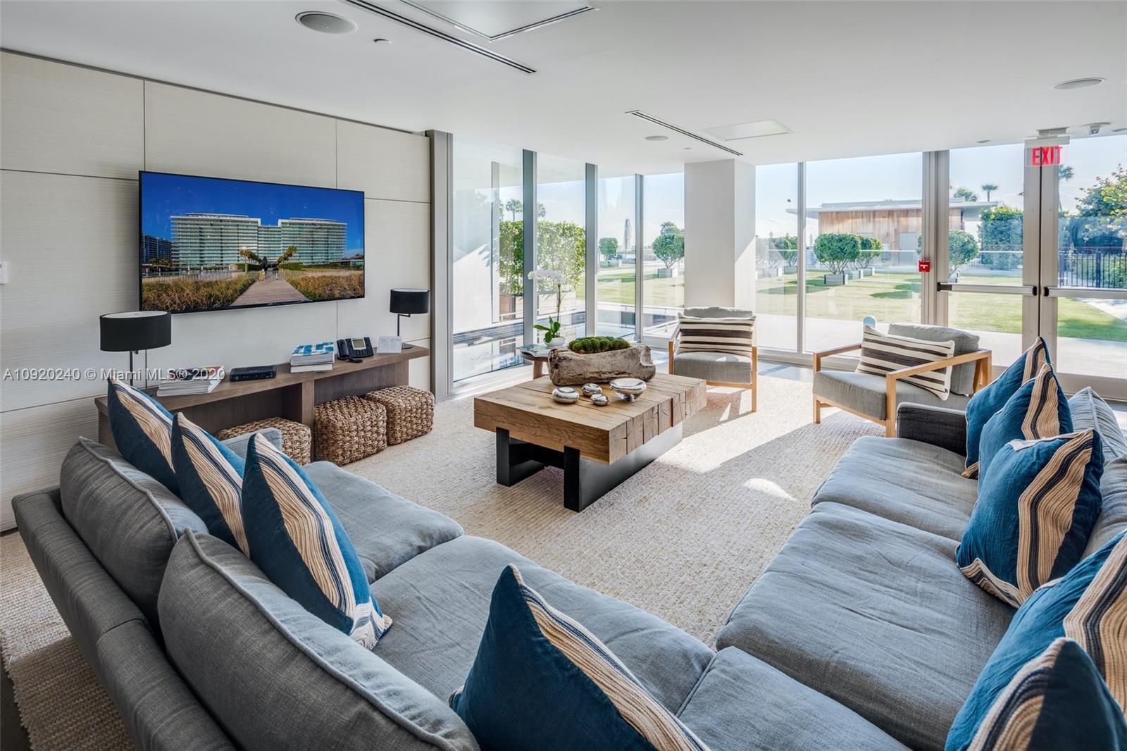 360 Ocean Drive, Unit 804S Key Biscayne, FL 33149 - Photo 37 of 49 a living room with furniture a flat screen tv and floor to ceiling window