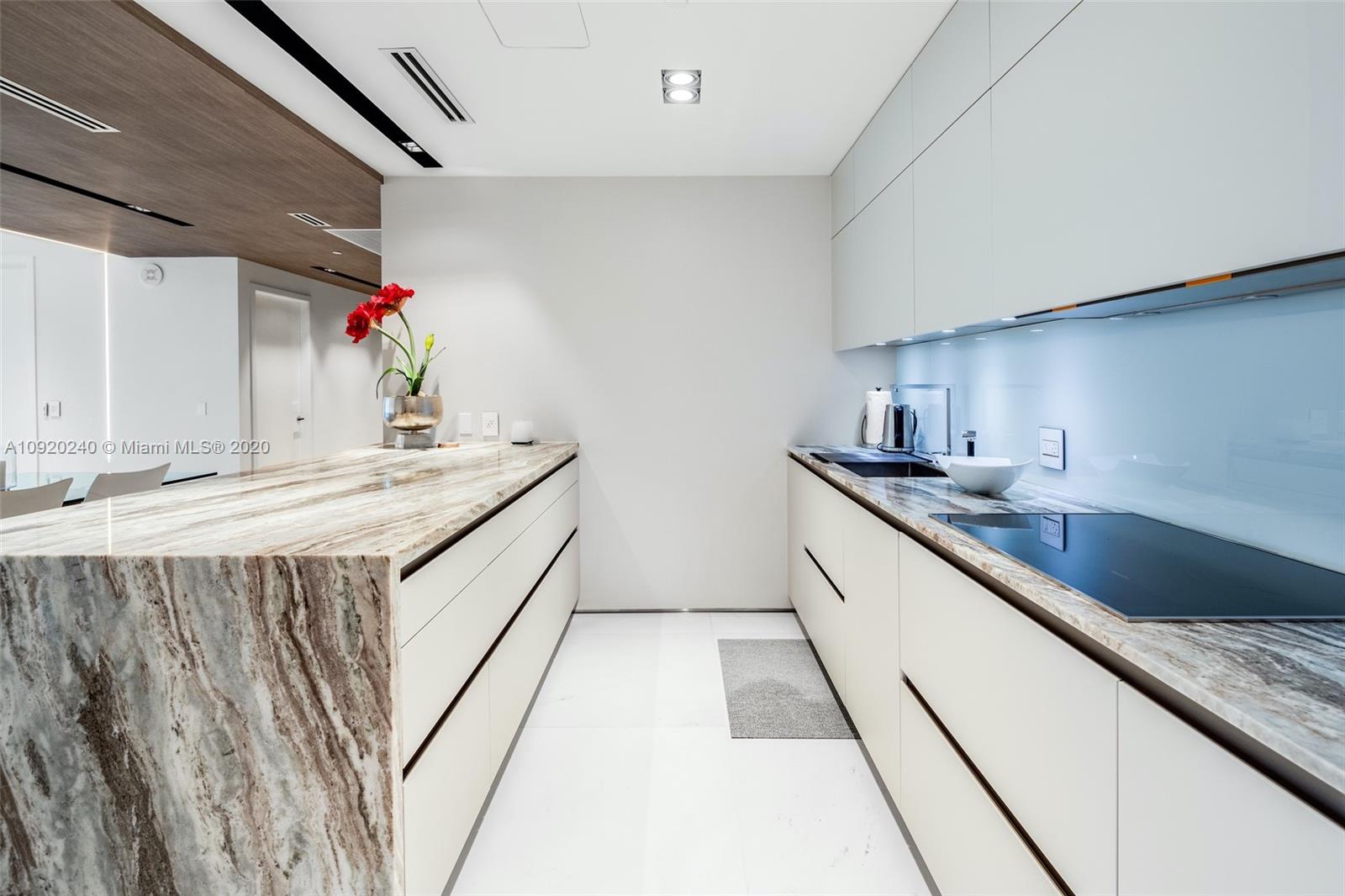 360 Ocean Drive, Unit 804S Key Biscayne, FL 33149 - Photo 5 of 49 a bathroom with double vanity and a bathtub