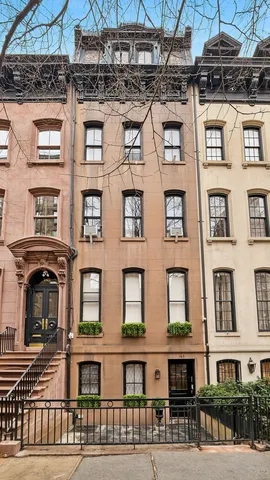 a view of a patio with table and chairs and potted plants