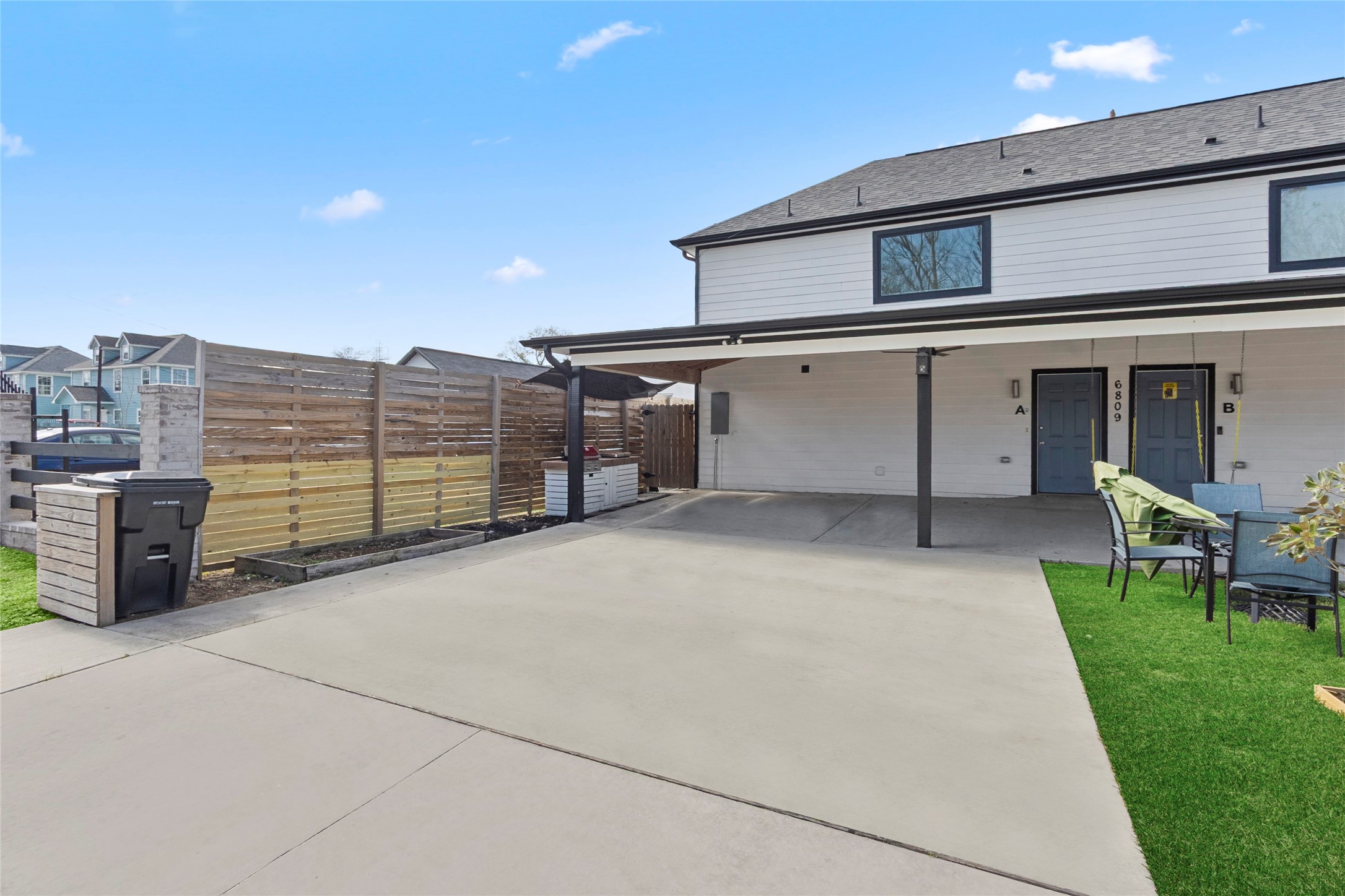 6809 Glass Street, Unit A Houston, TX 77016 - Photo 13 of 17 a view of a house with a yard and sitting area