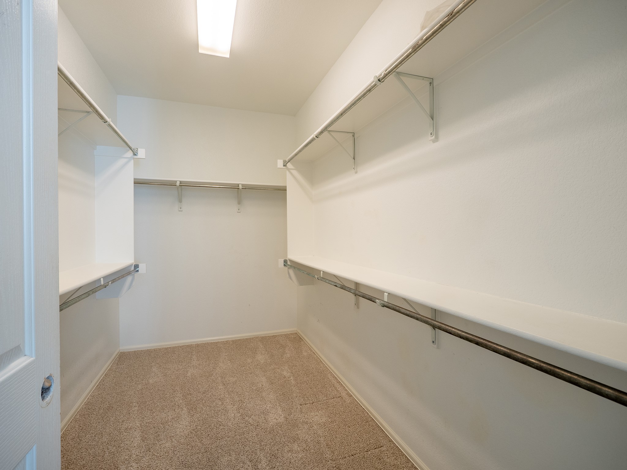 572 Big Meadow Road Austin, TX 78737 - Photo 18 of 32 Ample shelving and hanging space defines this well-organized walk-in closet.