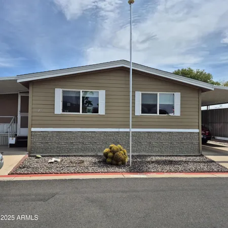 a front view of a house with parking space
