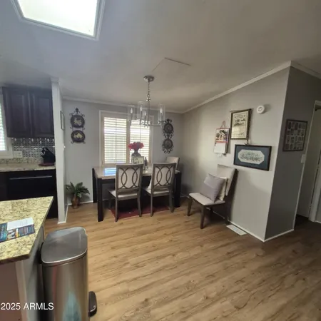 a view of a room with furniture and a window