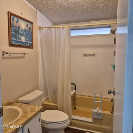 a spacious bedroom with a bed and a table