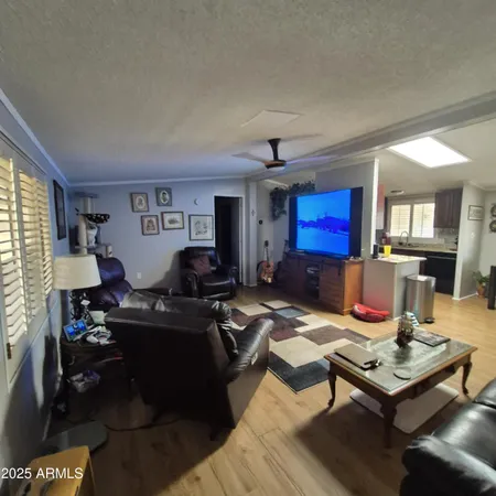 a living room with furniture or couch and a dresser
