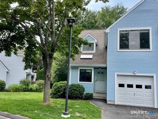 21 Field Rock Road, Unit 21 Farmington, CT 06032 - Photo 1 of 1 a front view of a house with garden