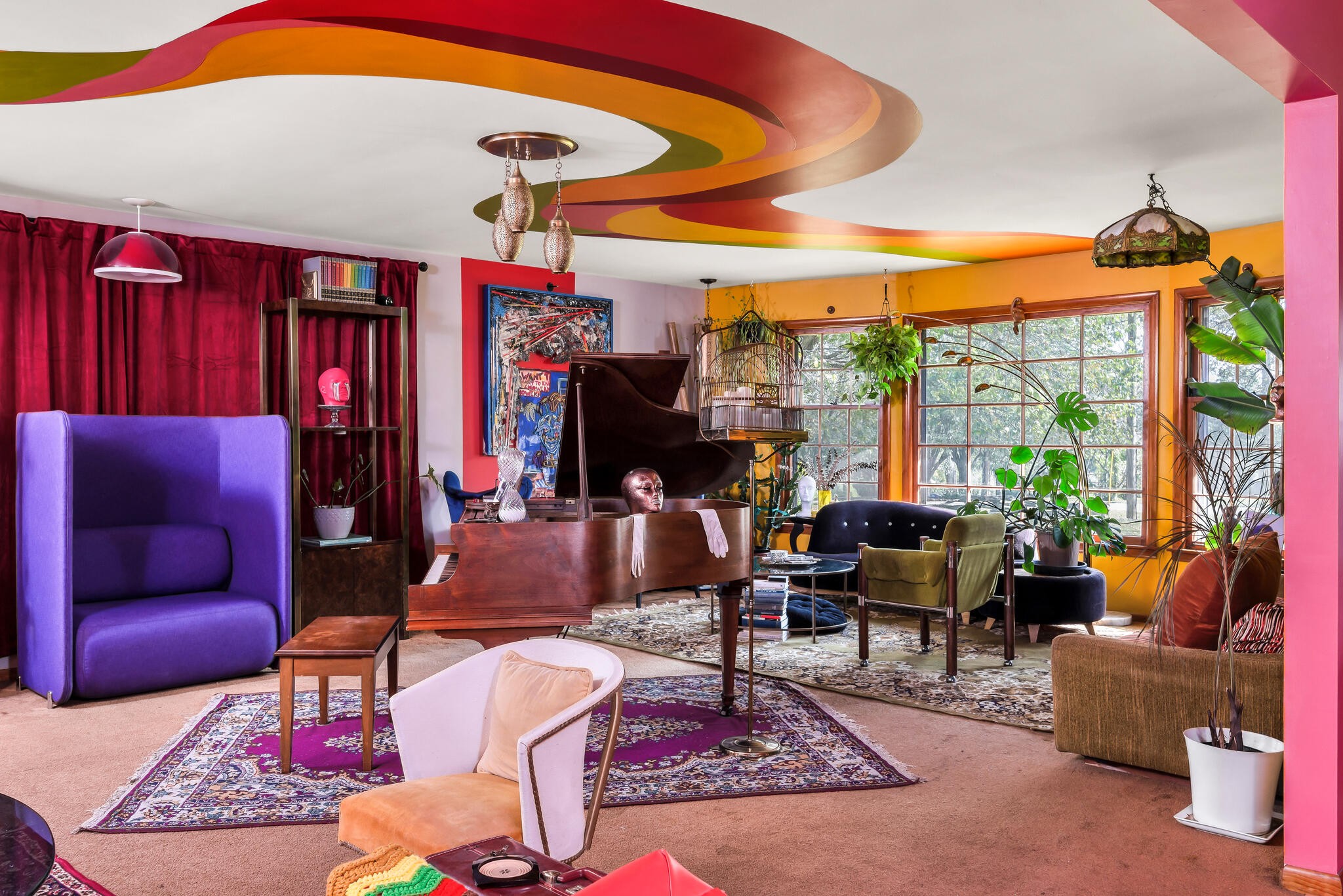 a living room with patio furniture and a large window