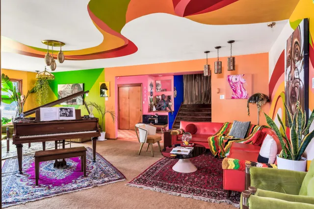 a bedroom with two beds and a window