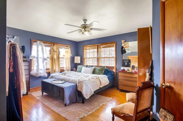 a spacious bathroom with a granite countertop double vanity sink and a mirror