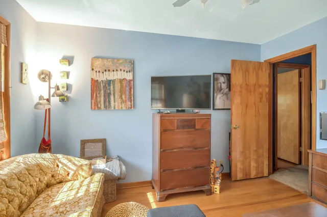 a bed room with furniture and a window