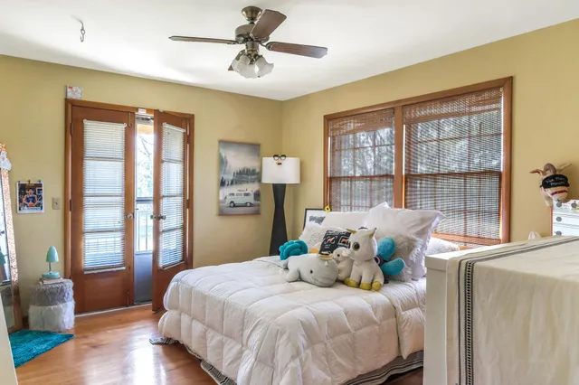 a bedroom with a large bed and a couch