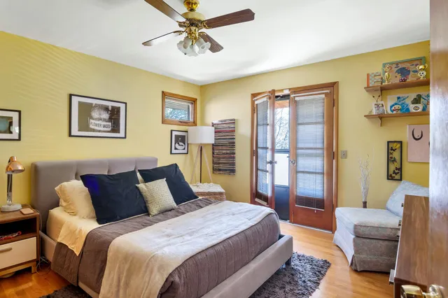 a living room with fireplace furniture and a large window