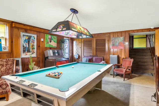 a view of a room with wooden ceiling