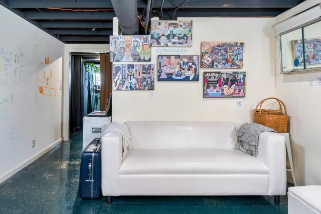 an outdoor sitting area with furniture and garden view
